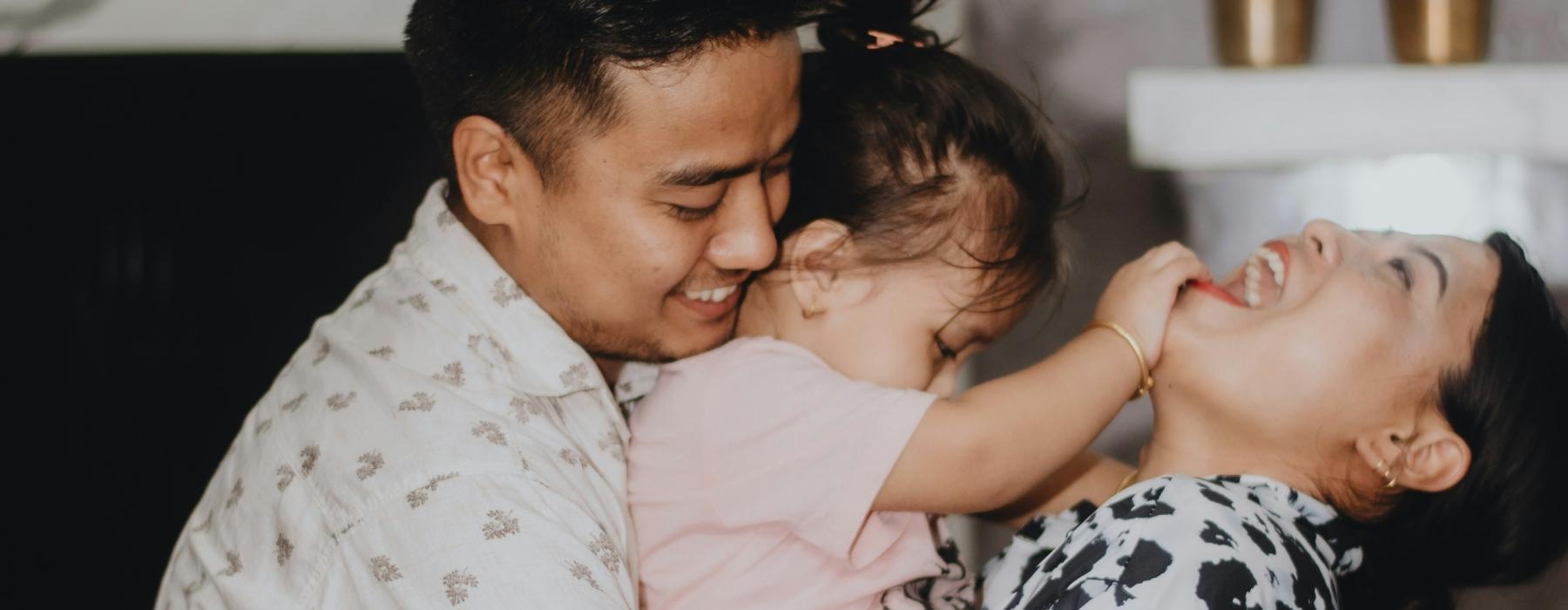 a couple holding a baby