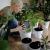 a person sitting on the floor with plants